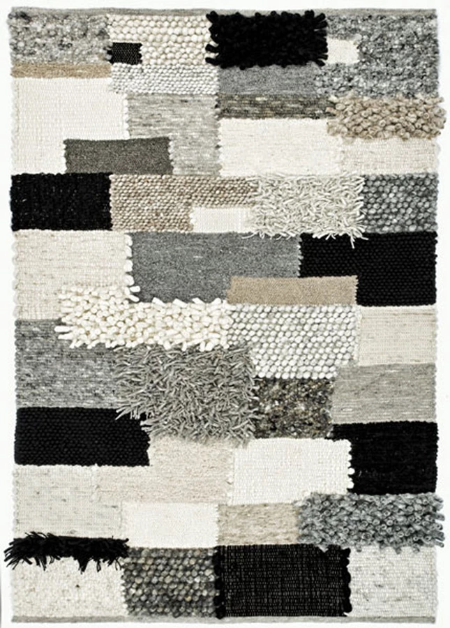 שטיח של המותג PAULIG, המשלב שיטות אריגה שונות המייצרות מראה תלת מימדי עשיר | ניתן להשיג ב׳צמר שטיחים יפים׳.
